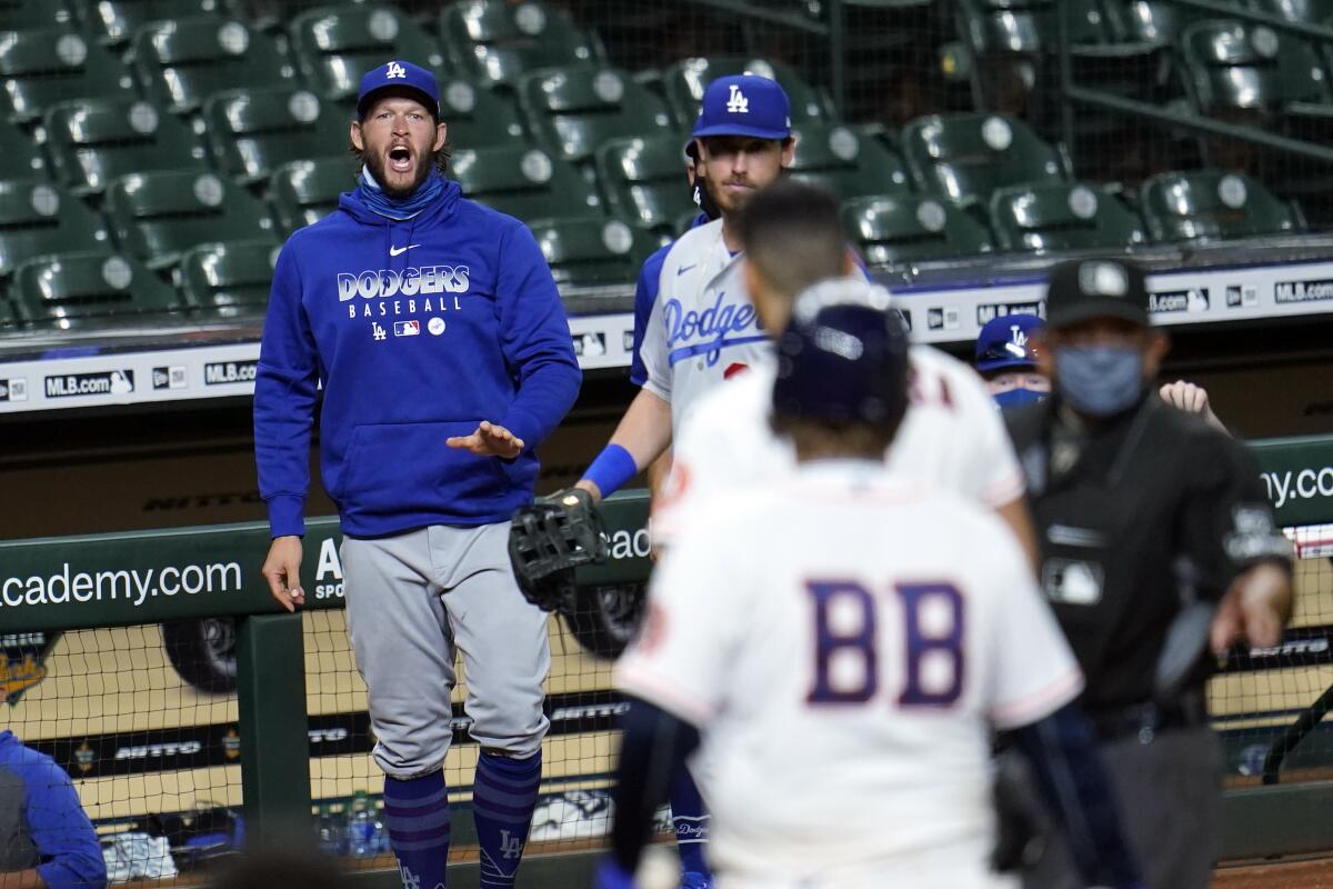 Dodgers pitcher Clayton Kershaw, left, yells toward the Houston Astros' Carlos Correa.