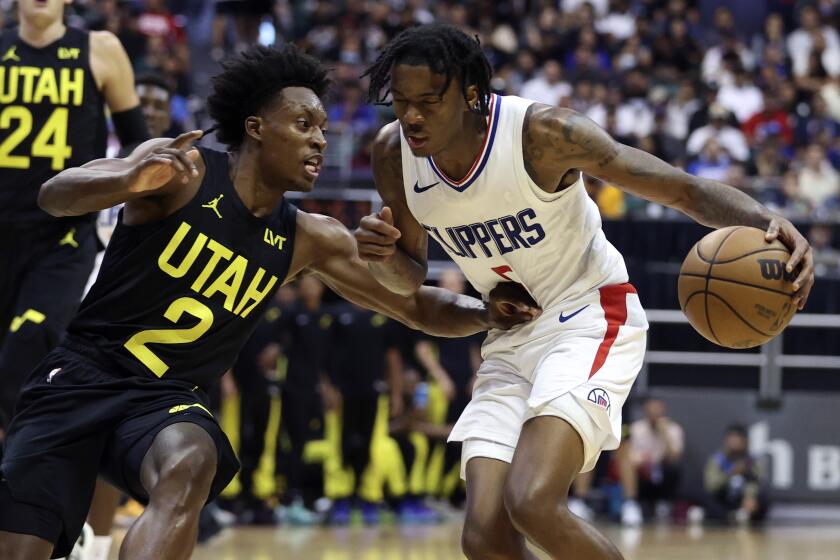 Utah Jazz's Collin Sexton (2) guards Los Angeles Clippers' Bones Hyland (5) during the third quarter.