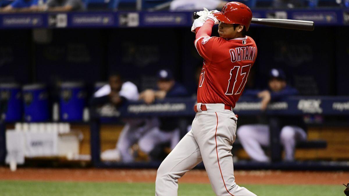 Angels' Shohei Ohtani hits a single in the eighth inning against the Tampa Bay Rays on Tuesday.