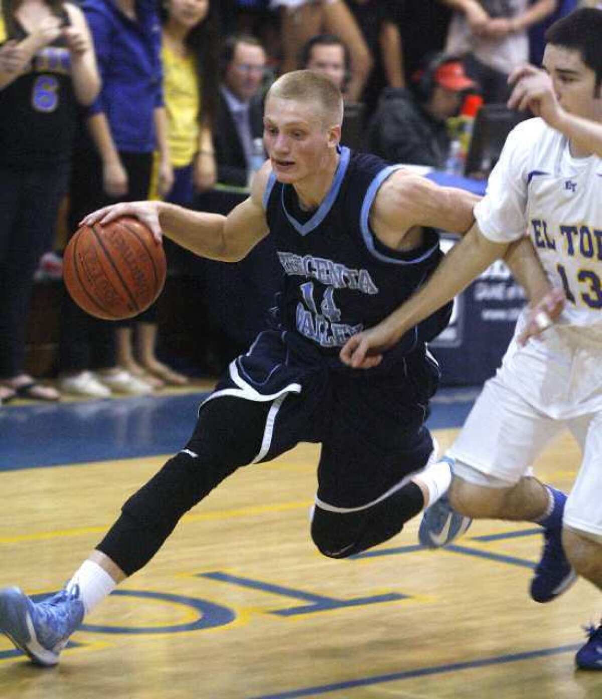 Crescenta Valley's Cole Currie drives to the basket against El Toro's Liam Skelly at El Toro High School in Lake Forest in a CIF Division 1A semifinal boys basketball game on Tuesday, February 26, 2013. (Tim Berger/Staff Photographer)