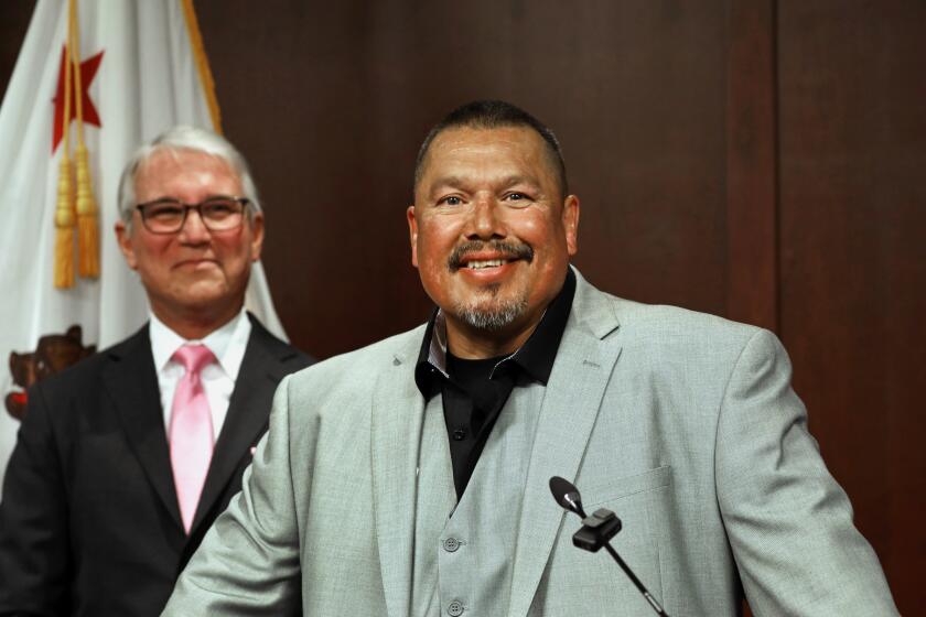 Los Angeles, California-May 25, 2023-On Thursday, May 25, 2023, District Attorney Gascon, left, announced the exoneration of Daniel Saldana, center, who was wrongly convicted of attempted murder of six people in 1990. Saldana was released after 33 years behind bars. (Carolyn Cole / Los Angeles Times)