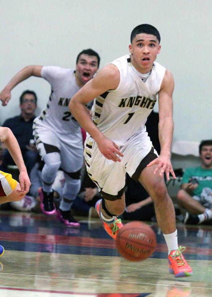 St. Francis' Evan Crawford, with a look of surprise after stealing the ball with seconds left on the game clock, looks up to the clock as his teammate Noah Willerford realizes that St. Francis is about to beat La Canada in a CIF SS Division III-A semifinal boys' basketball game played at Maranatha High School in Pasadena on Friday, February 28, 2014. St. Francis won the game to move on to the championship game.