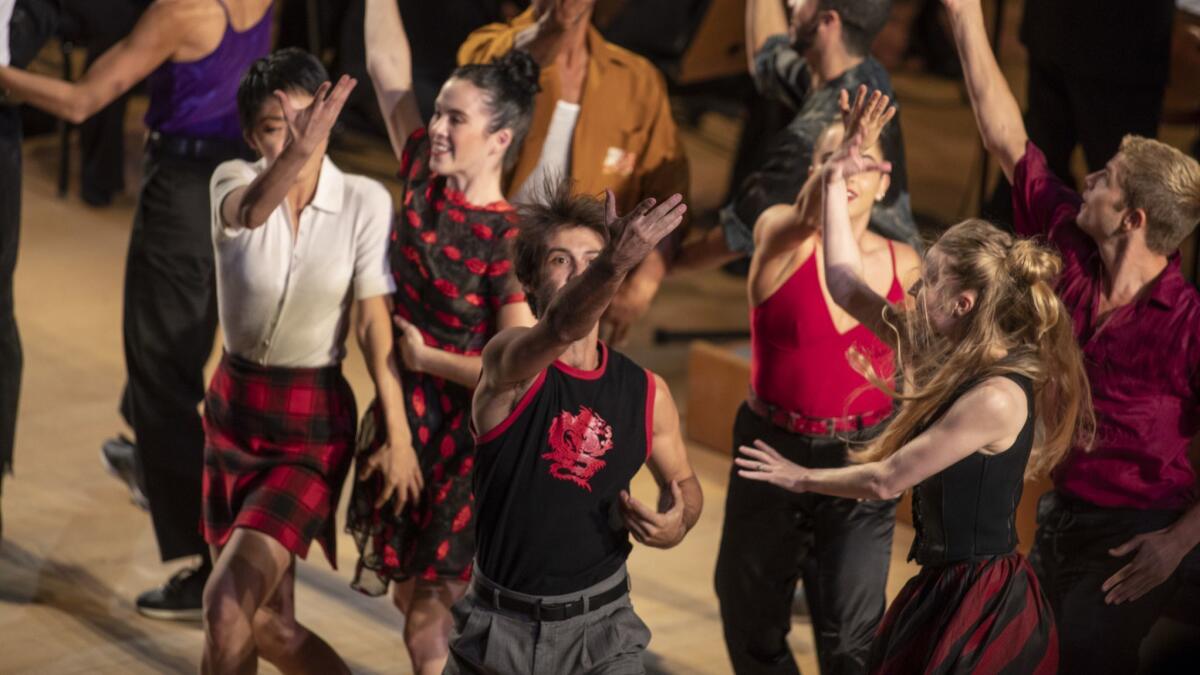 Members of the L.A. Dance Project perform as Gustavo Dudamel conducts the L.A. Philharmonic in Prokofiev's "Romeo and Juliet" on Thursday at Disney Hall.