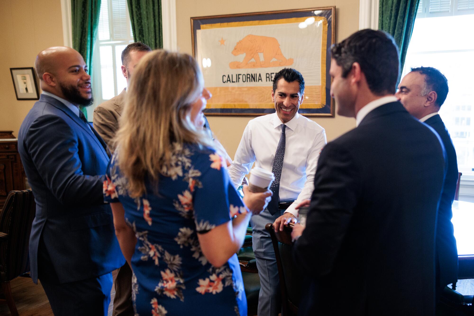 Robert Rivas chats with fellow assemblymembers in the Speaker's Office at the Capitol in Sacramento