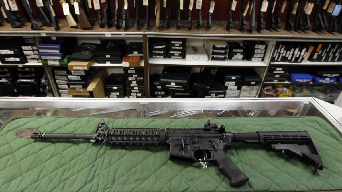 An AR-15 style rifle is displayed at the Firing-Line Indoor Range and Gun Shop in Aurora, Colo. on July 26, 2012.