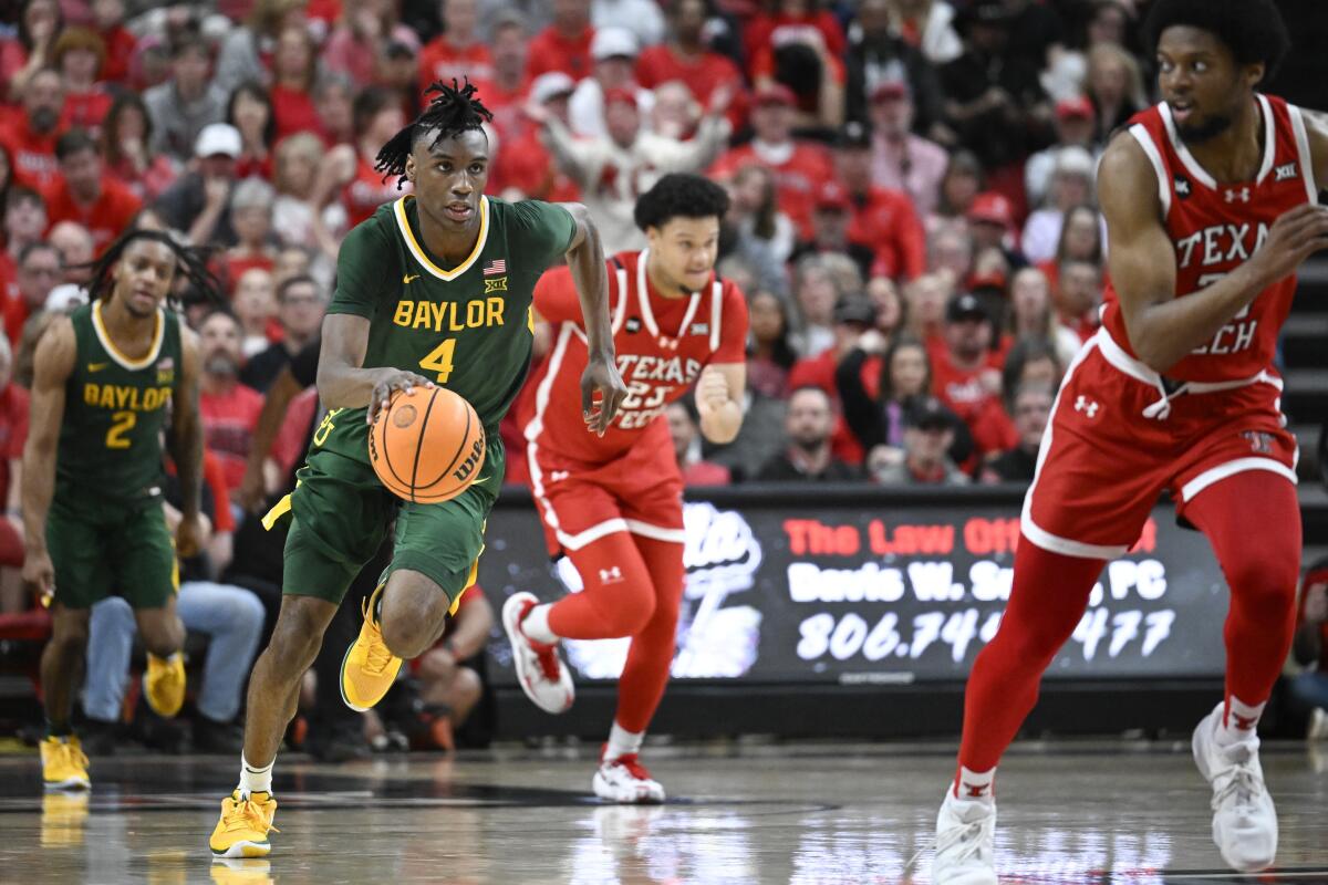 Baylor guard Ja'Kobe Walter (4) brings the ball up court against Texas Tech on March 9 in Lubbock, Texas.