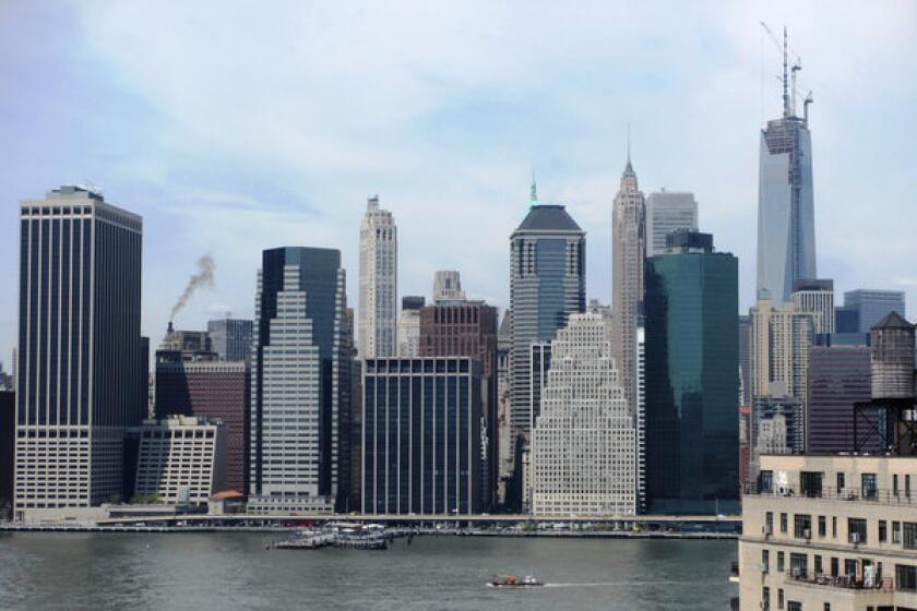 A view of lower Manhattan, and the spire (far right), taken from across the East River in Brooklyn.