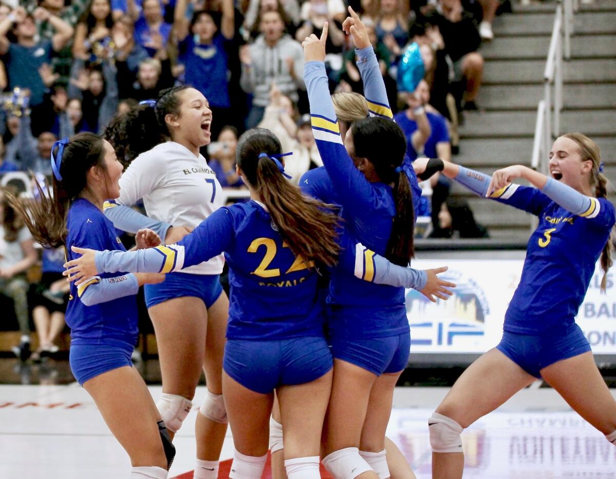 El Camino Real players celebrate the final point of their four-set victory over Taft.