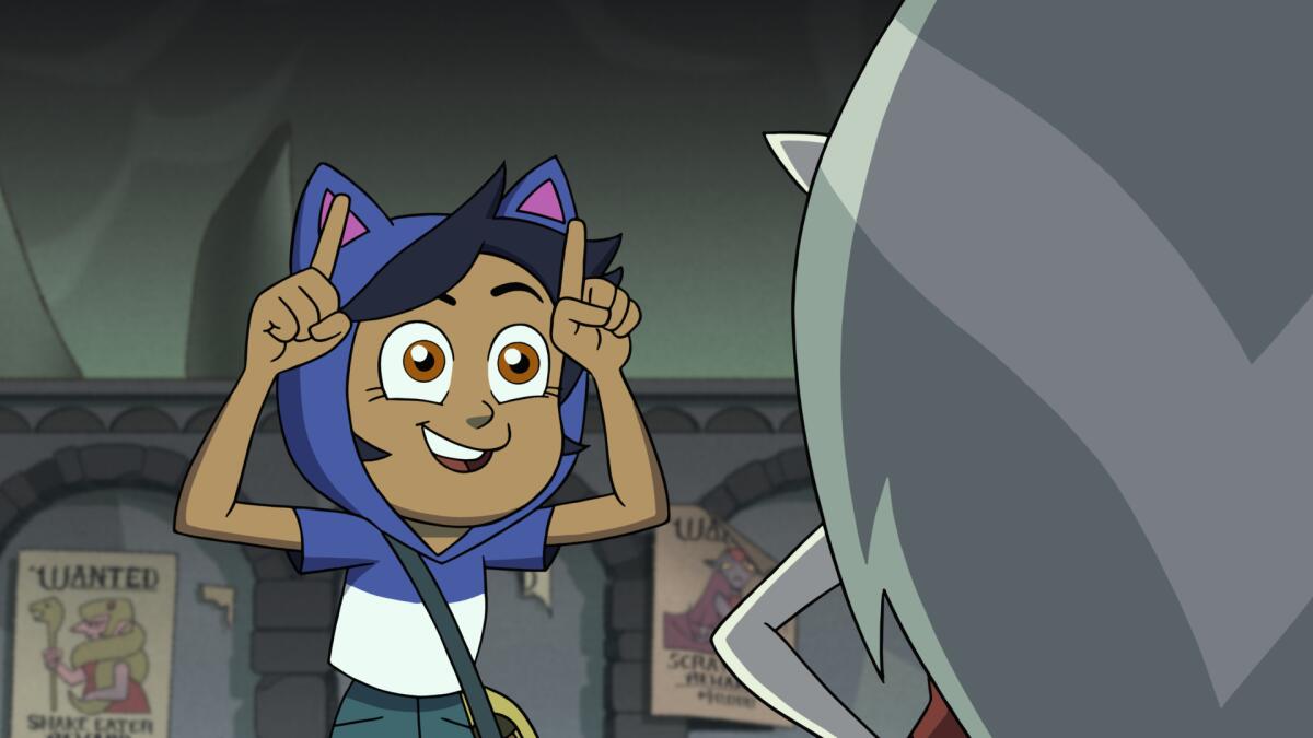An animated girl wearing a cat-ear-hooded shirt