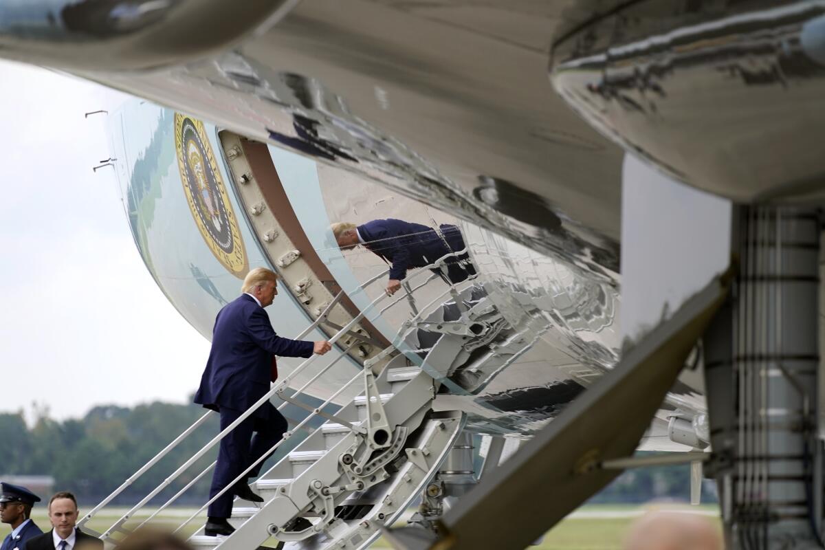 President Donald Trump boards Air Force One at Wilmington International Airport, Wednesday, Sept. 2, 2020, in Wilmington, N.C. (AP Photo/Evan Vucci)