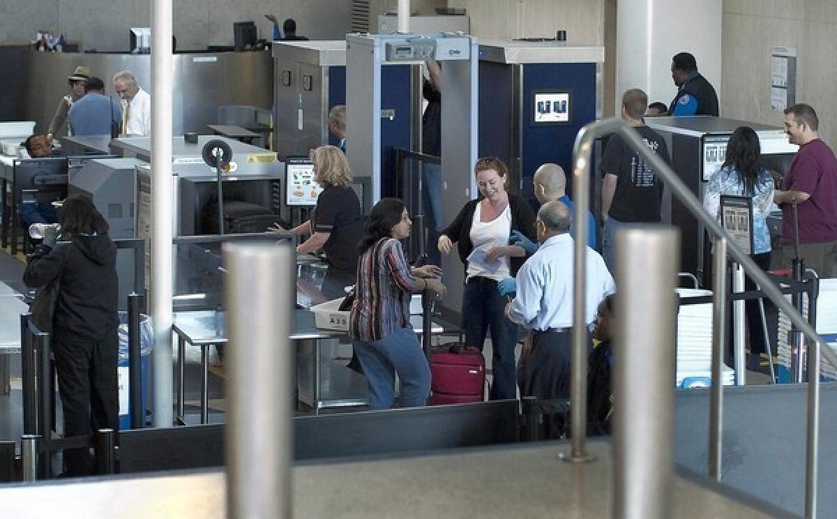 A 26% jump in misconduct cases among TSA workers over a three-year period stoked debate over their integrity. Above, security screening at Los Angeles International Airport in 2011.