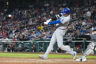 Los Angeles Dodgers designated hitter Shohei Ohtani hits a solo home run during the ninth inning of a baseball game against the Washington Nationals at Nationals Park, Tuesday, April 23, 2024, in Washington. The Dodgers won 4-1. (AP Photo/Alex Brandon)