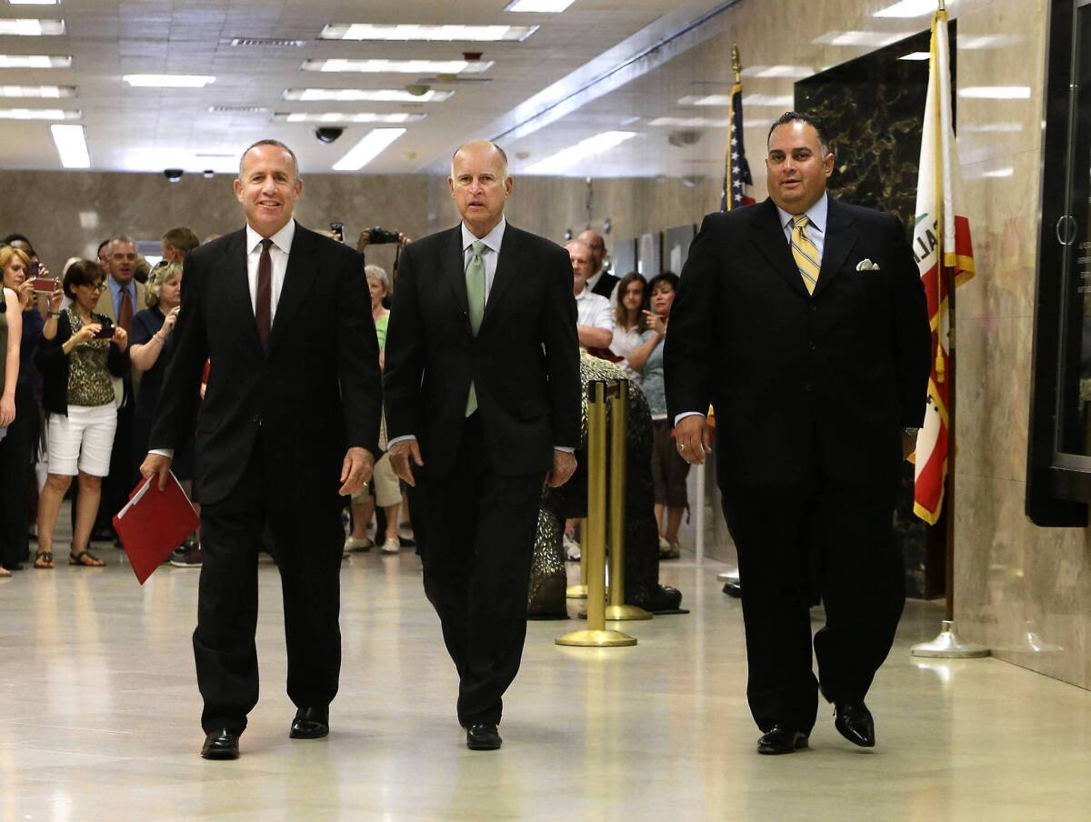 State Senate leader Darrell Steinberg (D-Sacramento), left, Gov. Jerry Brown and Assembly Speaker John Pérez (D-Los Angeles) walk to a news conference in the Capitol to discuss the budget compromise they reached.