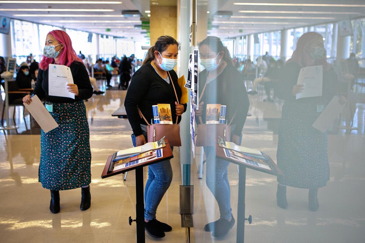 A woman enters the legal aid clinic located inside Martin Luther King, Jr. Outpatient Center