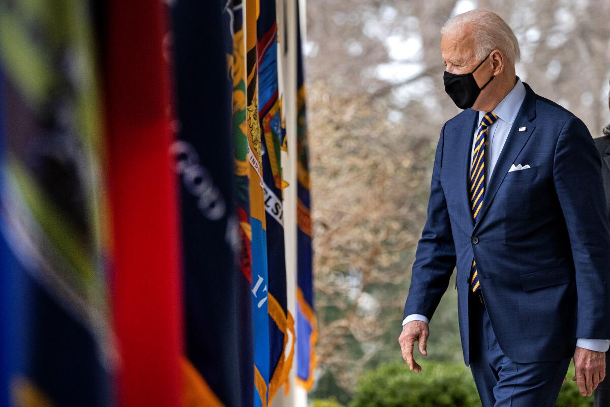 President Biden walks on the South Lawn of the White House in Washington.