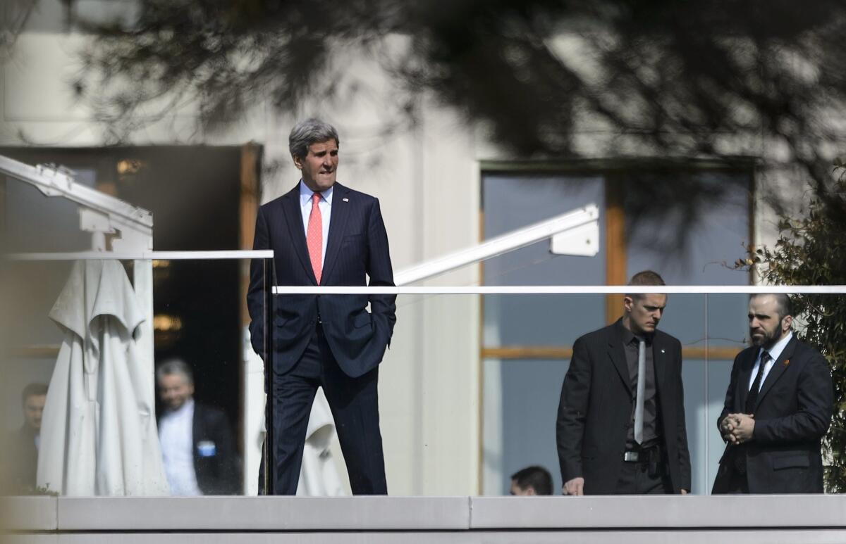 U.S. Secretary of State John F. Kerry takes a break during nuclear talks with Iran in Lausanne, Switzerland.