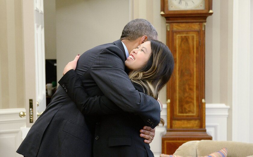 President Obama hugs Dallas nurse and Ebola survivor Nina Pham after her release from treatment Oct. 24.