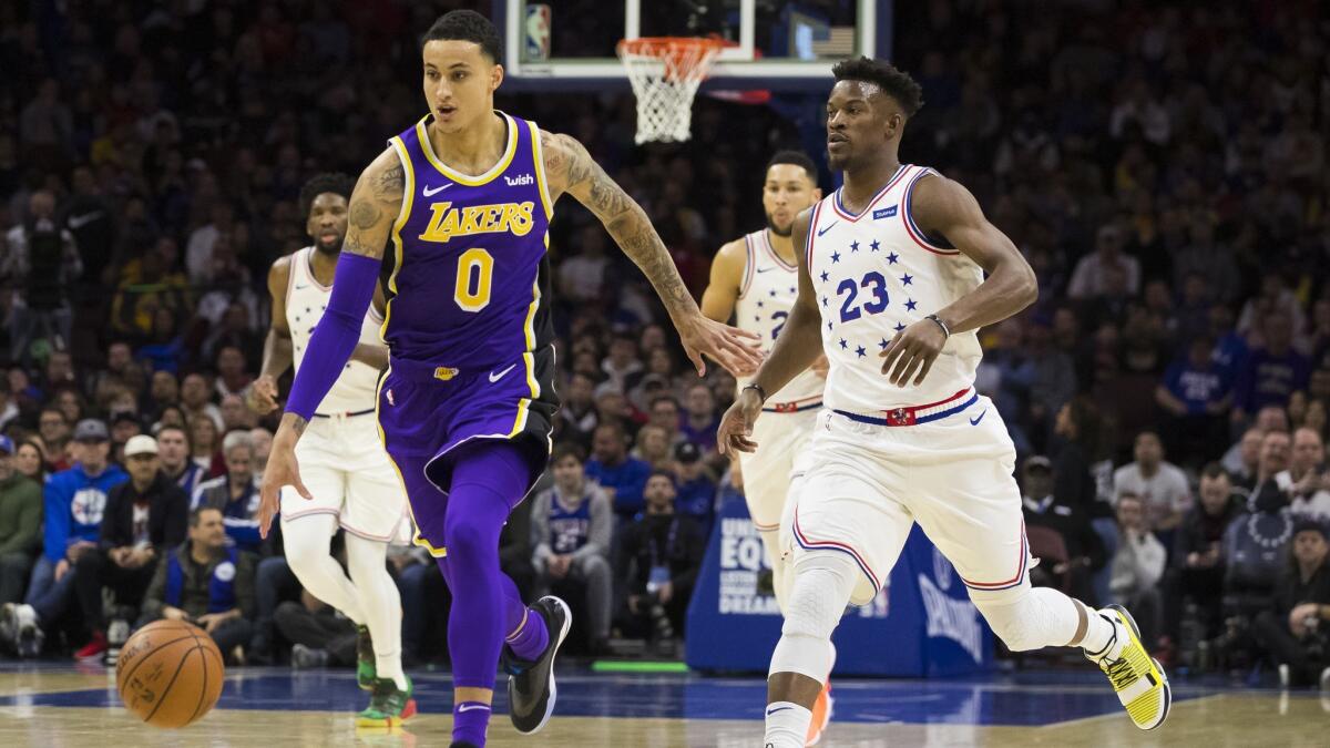 Lakers forward Kyle Kuzma scores 39 points against Jimmy Butler and the 76ers in Sunday's game.