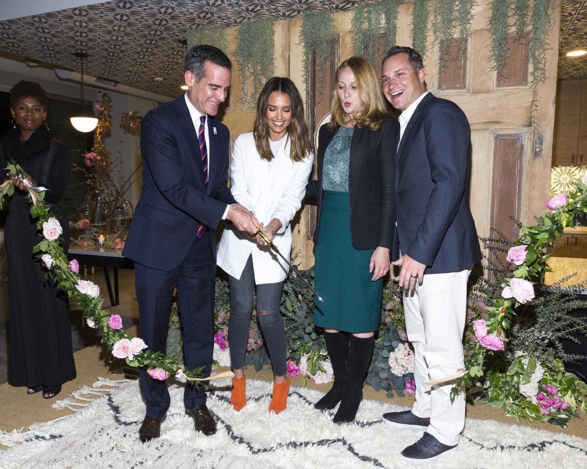 L.A. Mayor Eric Garcetti, left, Honest Co. founder Jessica Alba, L.A. first lady Amy Wakeland and Honest President Sean Kane at the ribbon-cutting for the company's new headquarters in Playa Vista. (Rich Polk / Getty Images)