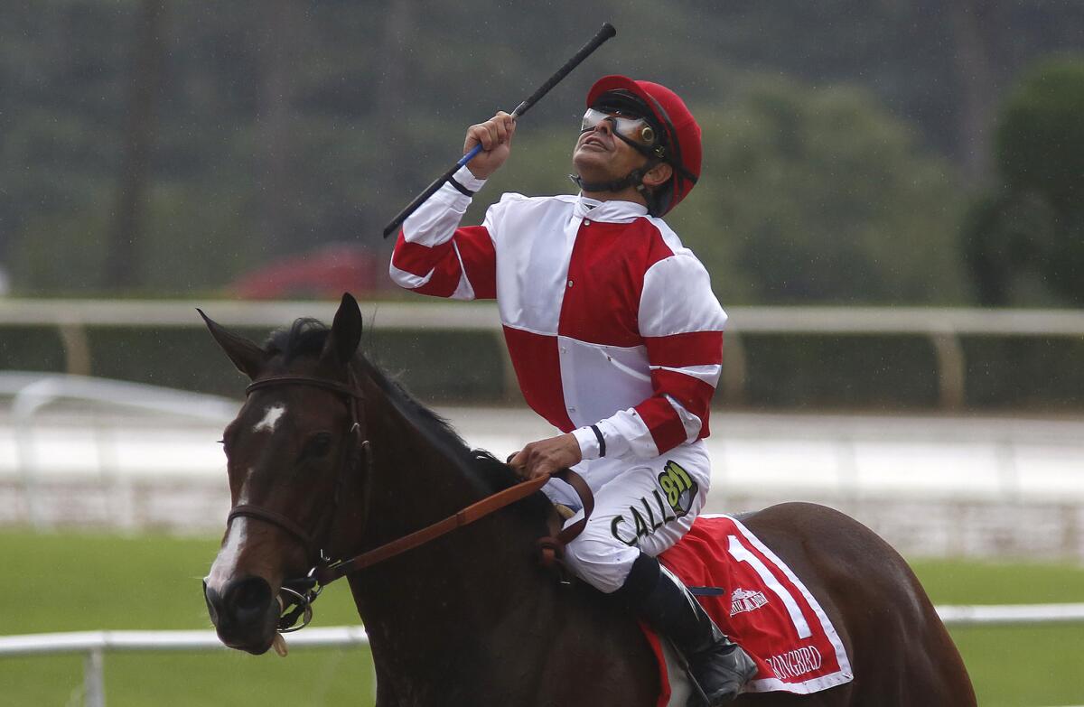 Jockey Mike Smith celebrates after riding Songbird to an easy win in the Santa Anita Oaks on April 9.