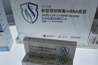 China's first SARS-CoV-2 mRNA vaccine AWcorna, developed by Abogen Biosciences, Walvax Biotechnology, and the Academy of Military Medical Sciences' Institute of Biotechnology, is displayed at the National 13th Five-Year Scientific and Technological Innovation Achievement Exhibition in Beijing, China on Oct. 27, 2021. More than two years into the pandemic, China has not approved the more effective mRNA vaccines, instead choosing to pursue its own route on COVID-19 vaccines. (Chinatopix via AP)