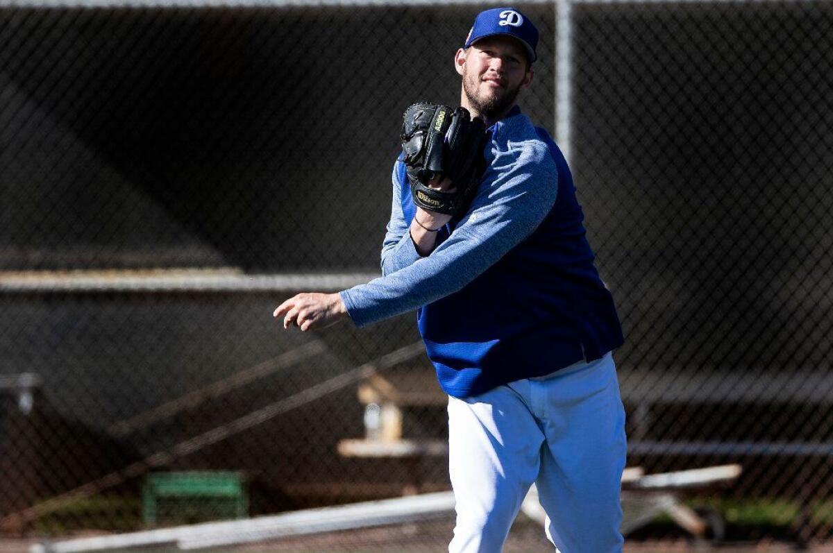 Dodgers pitcher Clayton Kershaw plays catch during spring training at Camelback Ranch in Glendale, Ariz., last week.