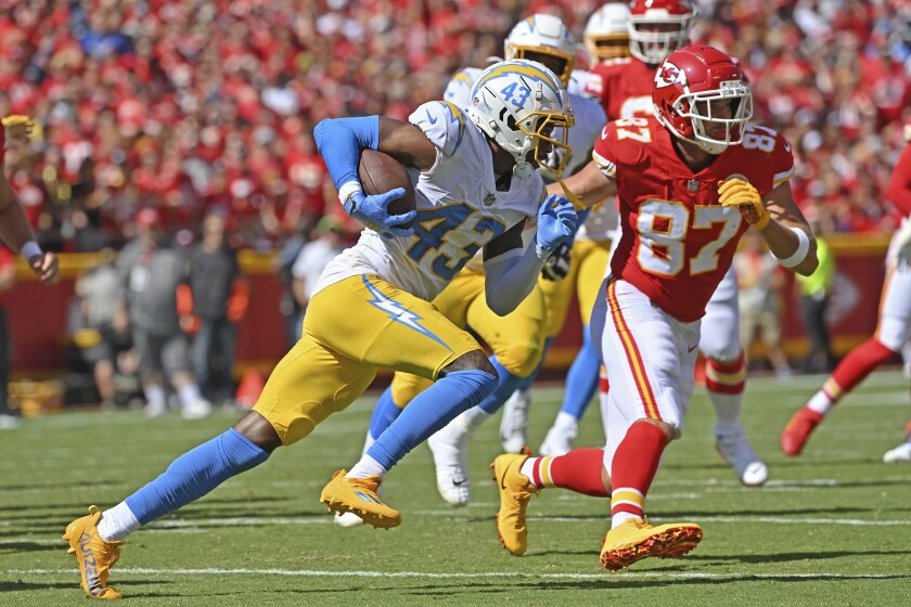 Chargers cornerback Michael Davis runs up field after picking up a fumble against the Kansas City Chiefs