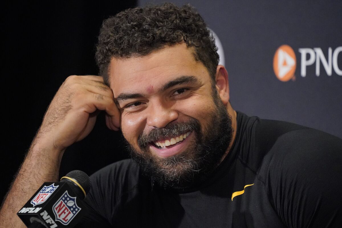 FILE - Pittsburgh Steelers defensive end Cameron Heyward meets with reporters after an NFL football game against the Baltimore Ravens in Pittsburgh, Sunday, Dec. 5, 2021. Cameron Heyward has been selected as the 2022 Good Guy Award winner by the Professional Football Writers of America. (AP Photo/Gene J. Puskar, File)