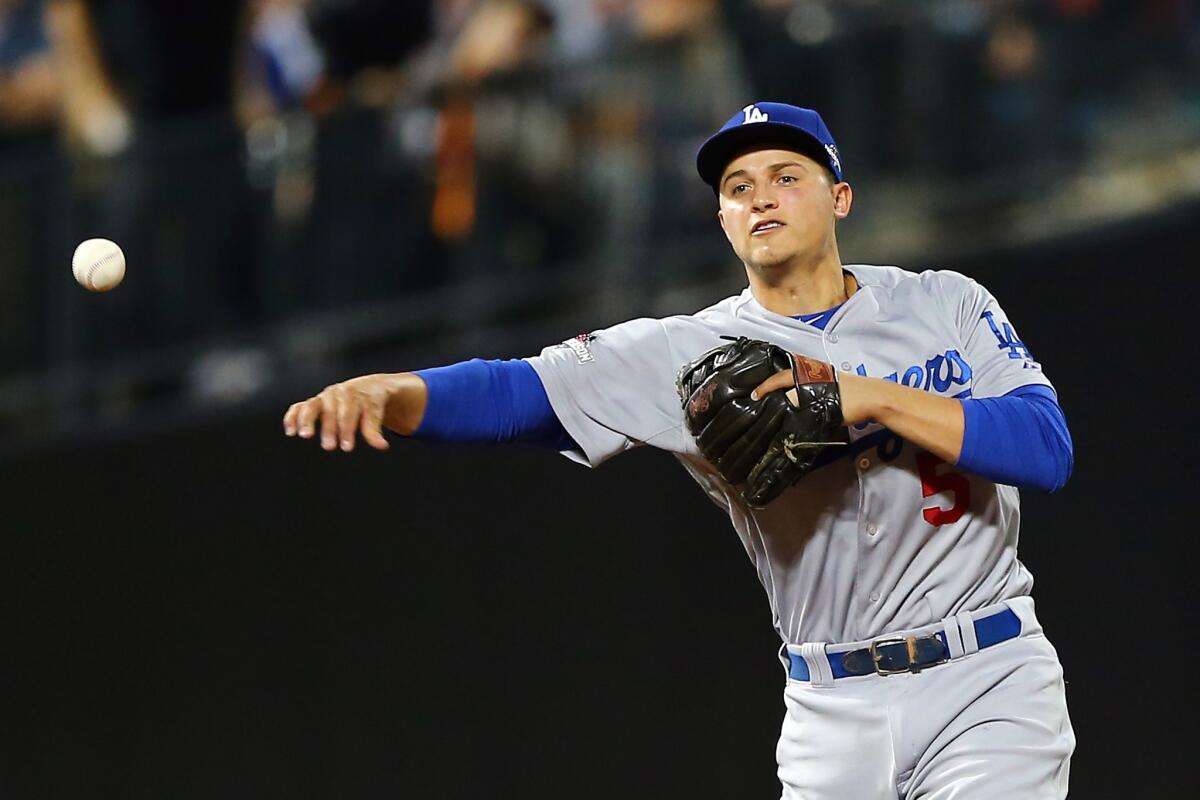 Corey Seager fields a ball against the New York Mets during an Oct. 13 playoff game at Citi Field in New York.