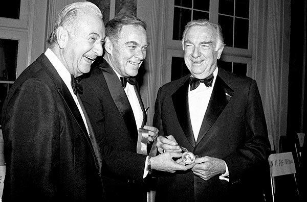 Secretary of State Alexander Haig, center, presents the Hughes Gold Medal to TV newscaster Walter Cronkite, right, in 1981.