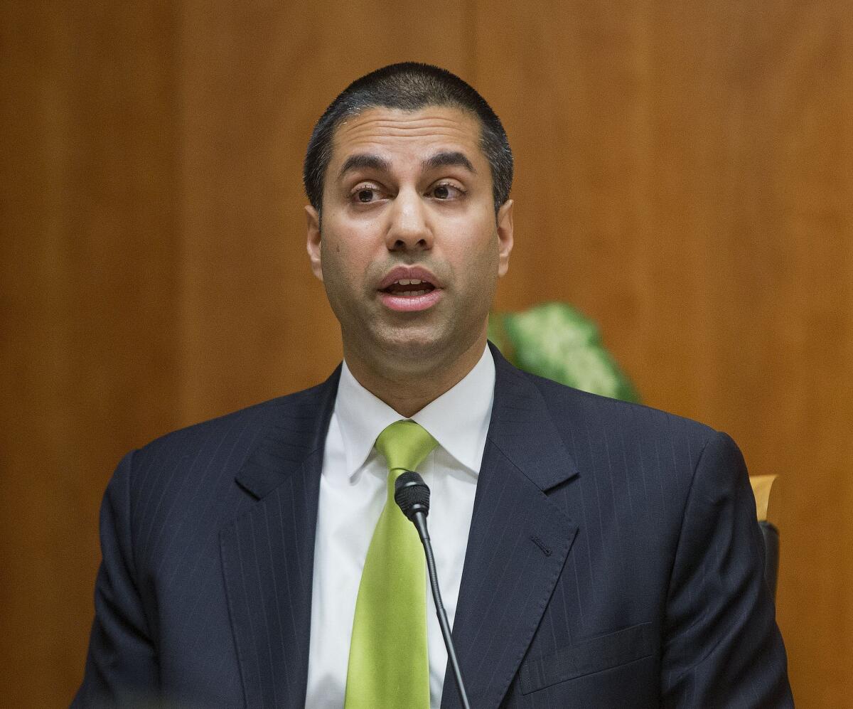 Federal Communications Commission Commissioner Ajit Pai speaks before the vote on net neutrality rules in Washington on Thursday. Pai, a Republican, opposed the rules along with fellow Republican Michael O'Rielly, while the three Democrats on the commission supported them.