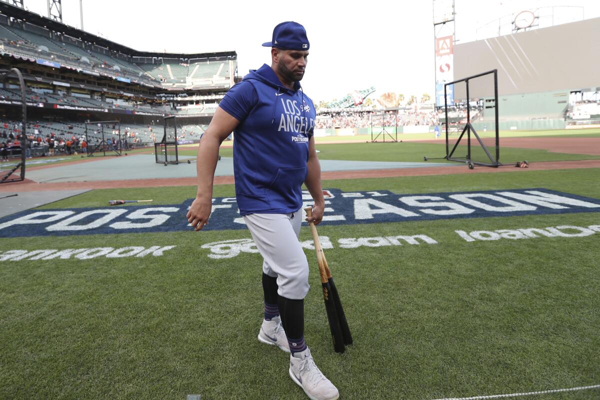 Los Angeles Dodgers' Albert Pujols warms up before Game 1 of a baseball National League Division.