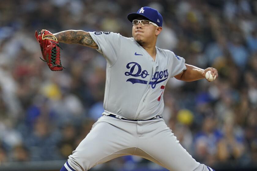 Los Angeles Dodgers starting pitcher Julio Urias works against a San Diego Padres.