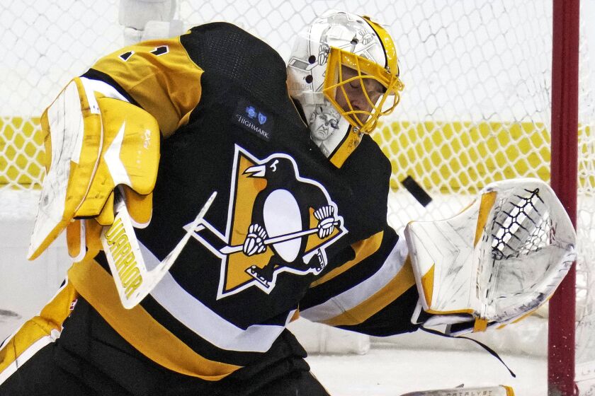 Pittsburgh Penguins goaltender Casey DeSmith blocks a shot during the second period of an NHL hockey game against the Washington Capitals in Pittsburgh, Saturday, March 25, 2023. (AP Photo/Gene J. Puskar)