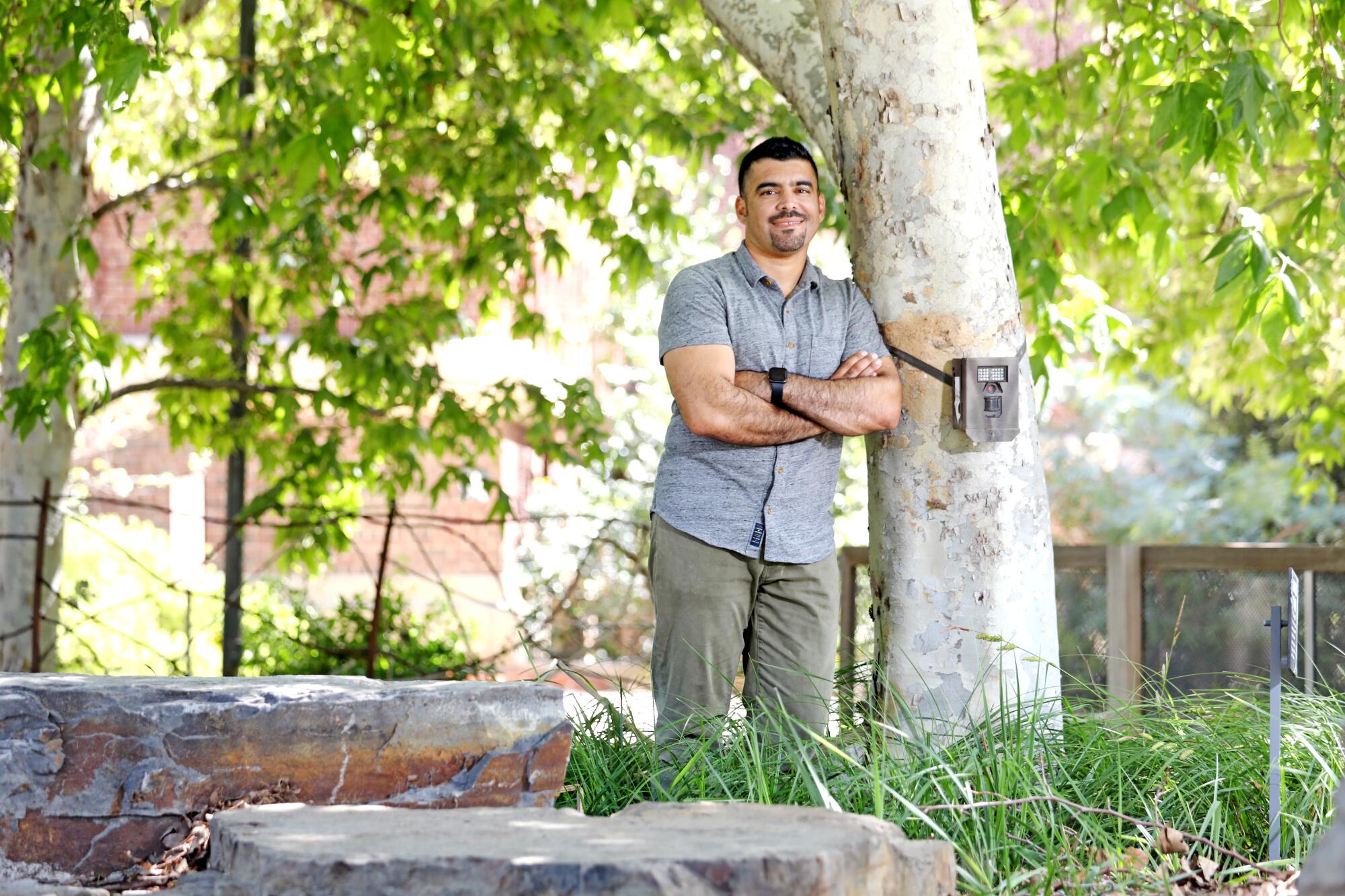 Miguel Ordeñana, senior manager of community science, with a camera trap at the Natural History Museum of Los Angeles.