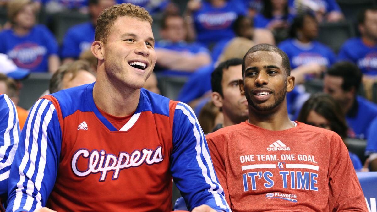 Clippers teammates Blake Griffin, left, and Chris Paul will be back on the court together when the team opens training camp Sept. 30 in Las Vegas.