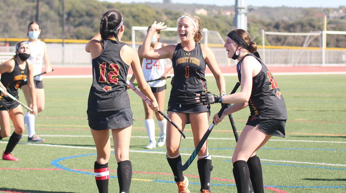 Faith Choe (#12), Jans Croon (#1) and Sophie Rosenblum celebrate a Choe goal (assisted by Croon) vs. Canyon Crest.