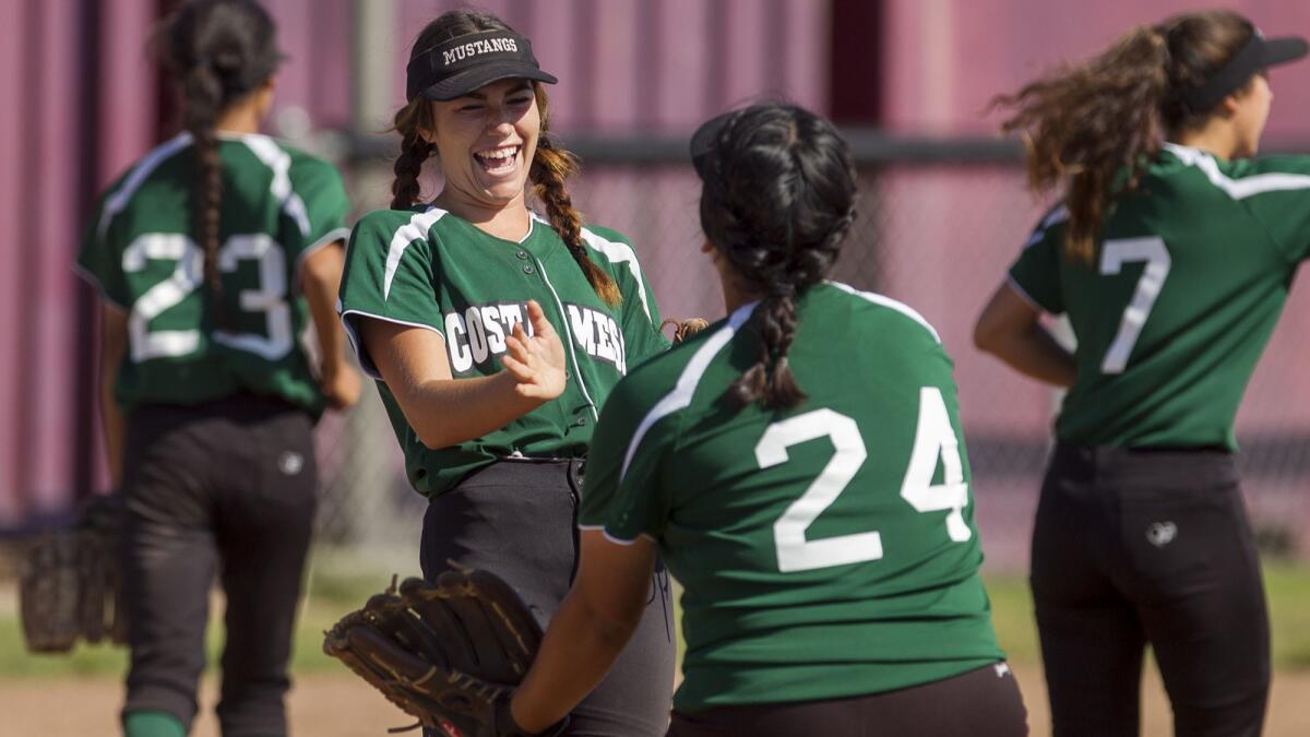 Costa Mesa High softball player Haley Sheffner, shown laughing during a game on April 21, 2017, had four total hits as the Mustangs won twice at their host tournament on Saturday.