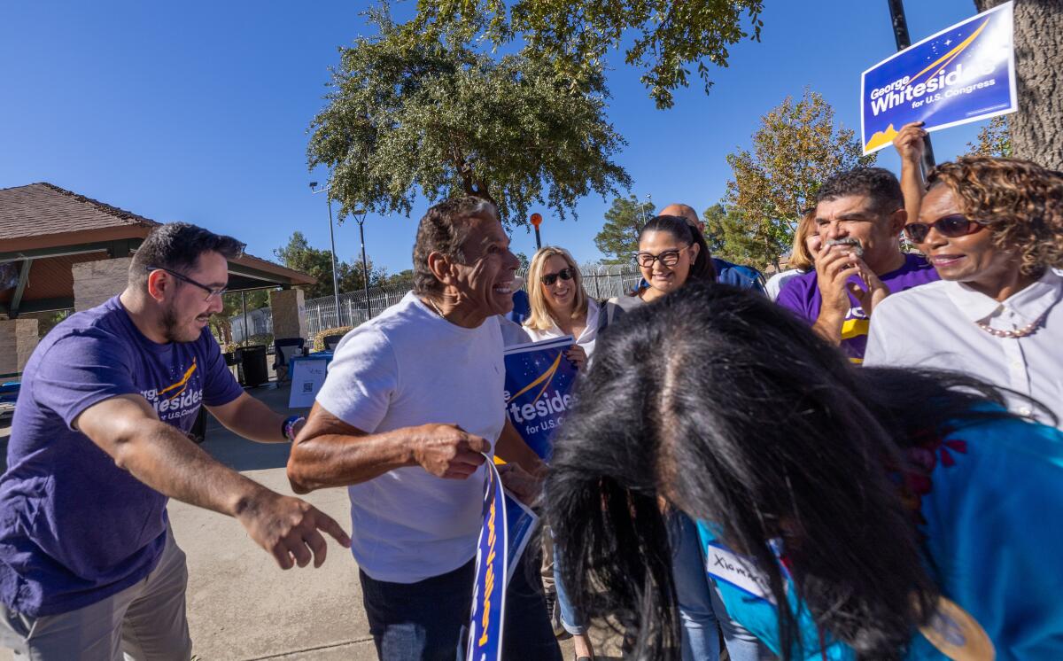 ormer Los Angeles mayor Antonio Villaraigosa, second from left, greets volunteers at a Democratic Party event at in Palmdale.