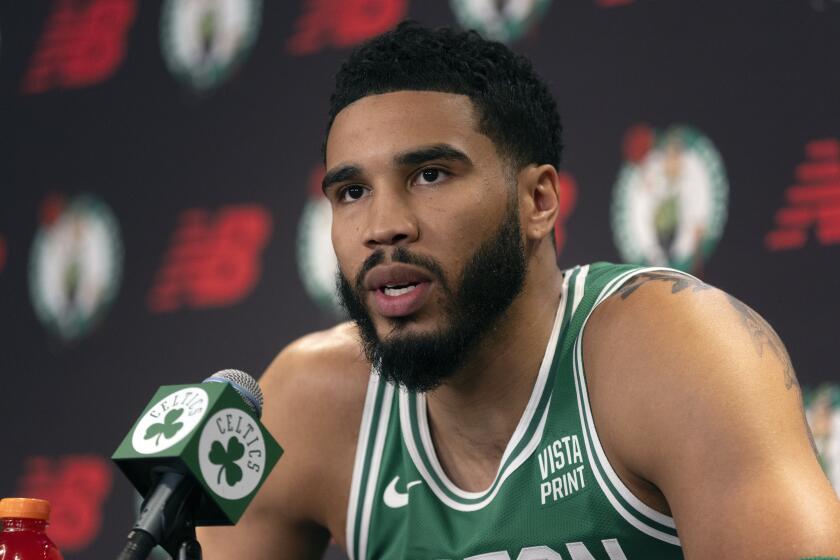 Boston Celtics' Jayson Tatum speaks at a news conference during the NBA basketball team's media day, Monday, Oct. 2, 2023, in Boston. (AP Photo/Michael Dwyer)