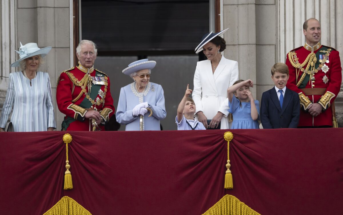 Royals young and old gather on a balcony at Buckingham Palace