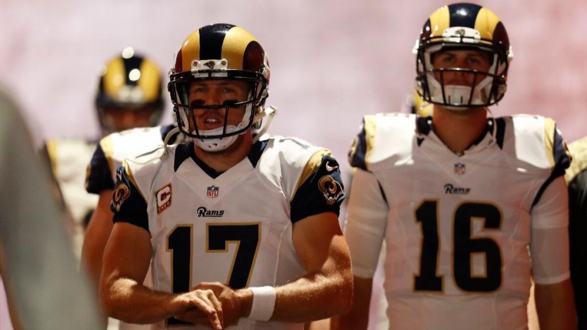 Rams quarterbacks Case Keenum (17) and Jared Goff (16) take the field before a game against the Panthers on Nov. 6.