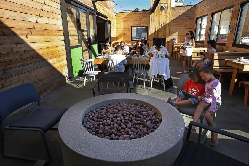 The warm patio at Dockside at Playa Provisions features two fire pits.