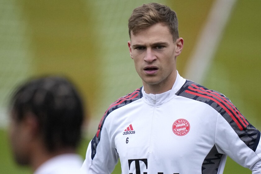 FILE - Bayern's unvaccinated Joshua Kimmich watches team mate Serge Gnabry during a training session in Munich, Germany, Monday, Nov. 1, 2021. Canceled games, players in quarantine, arguments over vaccine mandates. Sports in Germany are facing a winter of discontent and disruption as the country endures a fourth wave of spiraling coronavirus infections.(AP Photo/Matthias Schrader, File)