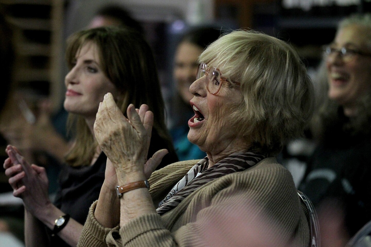 Instructor Karen Morrow applauds a student performance during one of her weekly singing workshops at the Westwood Presbyterian Church in Westwood on Monday, Mar. 24, 2014.