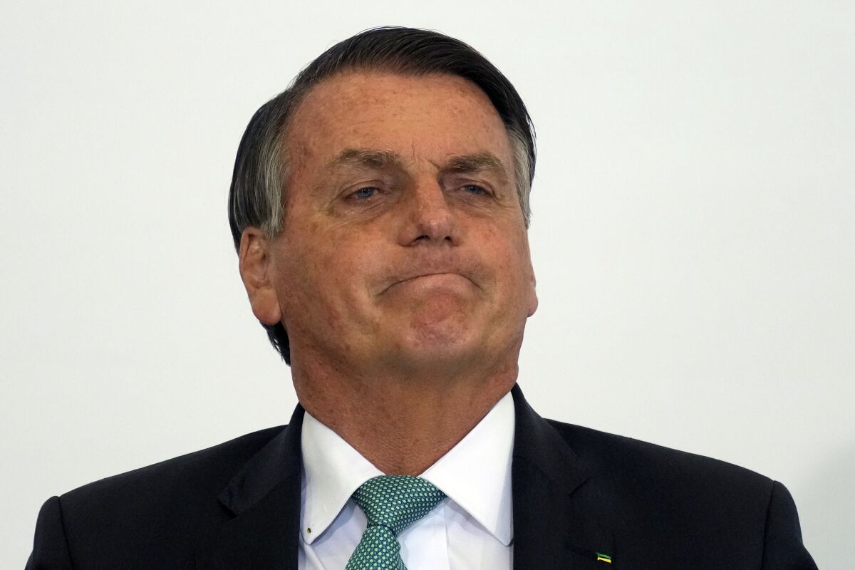Brazilian President Jair Bolsonaro attends the launch ceremony for a housing program at Planalto presidential palace in Brasilia, Brazil, Wednesday, Sept. 15, 2021. (AP Photo/Eraldo Peres)