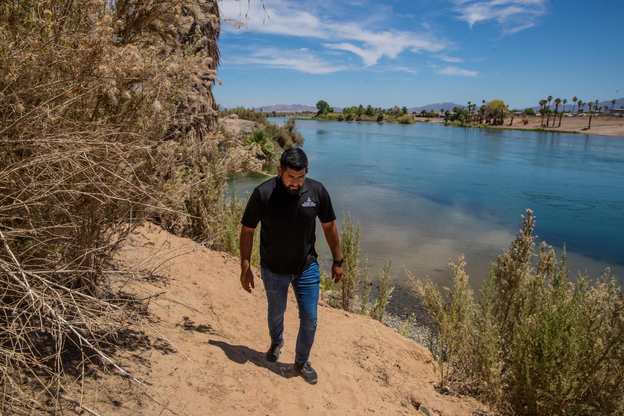Pastor Joshua Lopez Padilla ventures out on the banks of Colorado River.
