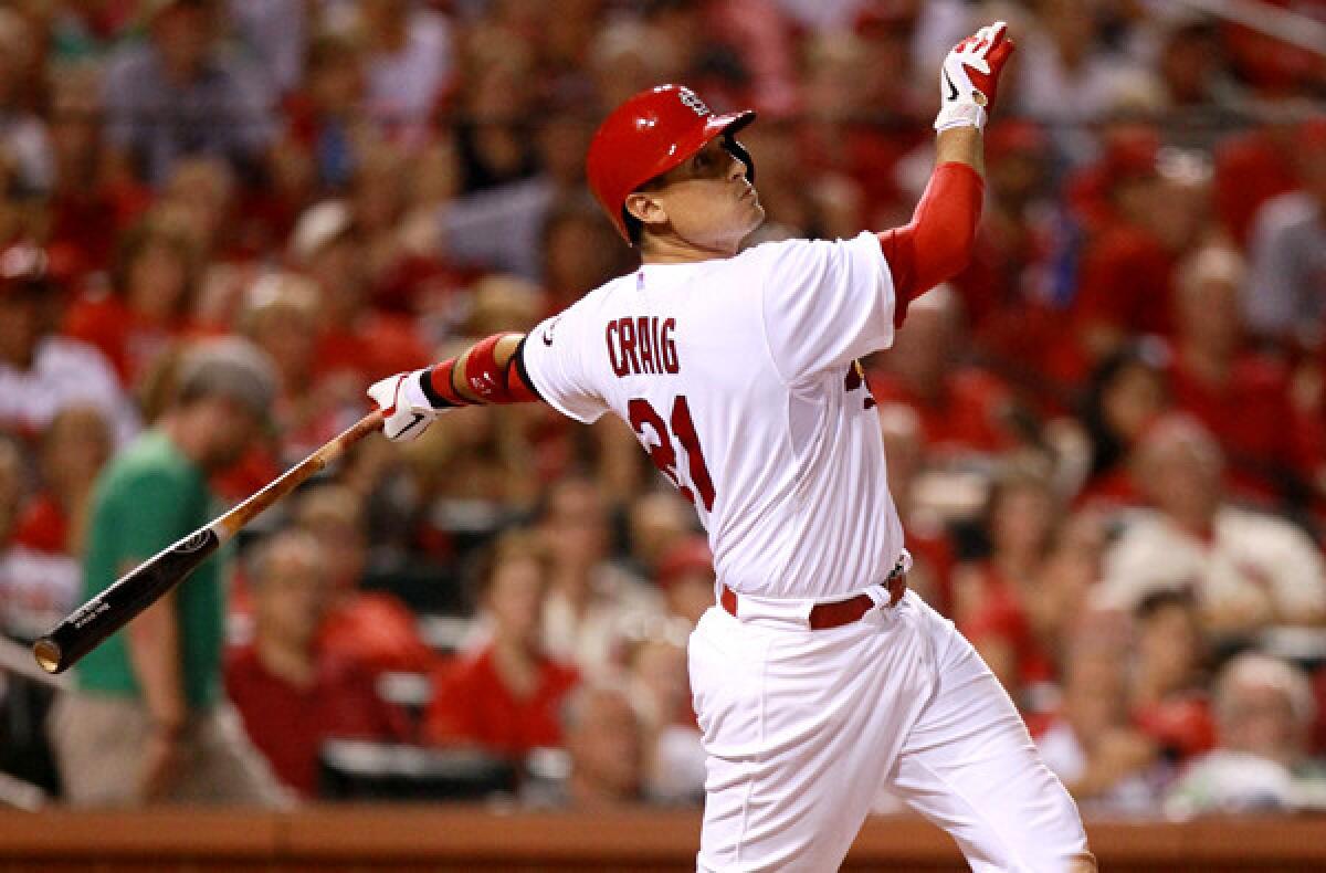 Cardinals first baseman Allen Craig hits a grand slam against the Cincinnati Reds during a regular-season game.