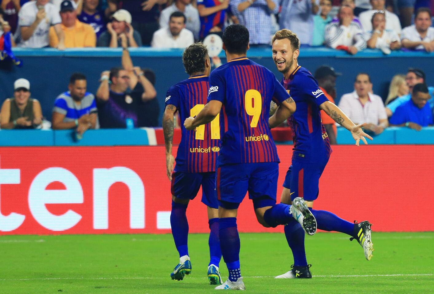 MIAMI GARDENS, FL - JULY 29: Ivan Rakitic #4 of Barcelona celebrates his goal with teammates Neymar #11 and Luis Suarez #9 in the first half against the Real Madrid during their International Champions Cup 2017 match at Hard Rock Stadium on July 29, 2017 in Miami Gardens, Florida. (Photo by Chris Trotman/Getty Images) ** OUTS - ELSENT, FPG, CM - OUTS * NM, PH, VA if sourced by CT, LA or MoD **