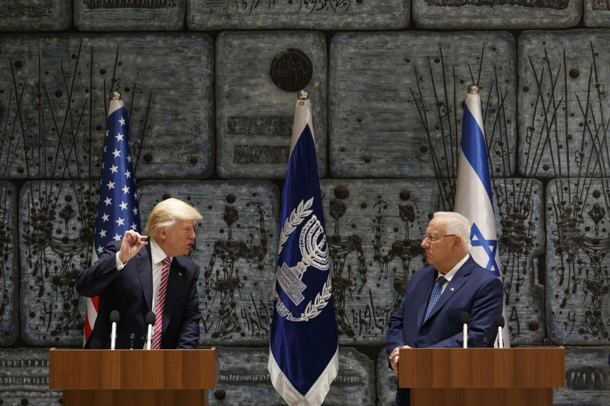 Israeli President Reuven Rivlin listens as President Trump speaks in Jerusalem on Monday.